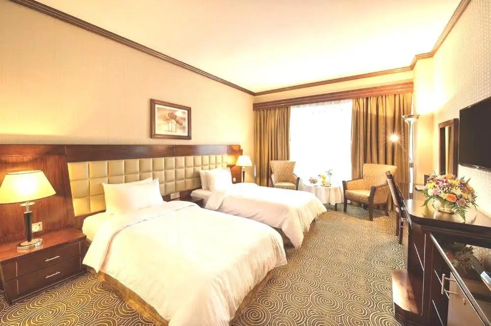 اتاق Deluxe Double Room در هتل Grand Central Hotel با طراحی کلاسیک و دکوراسیون گرم